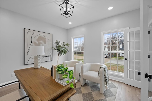 office area featuring light hardwood / wood-style flooring and an inviting chandelier