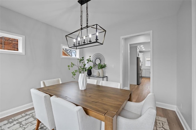 dining space featuring light wood-type flooring