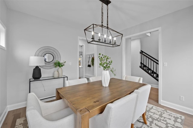 dining space featuring wood-type flooring