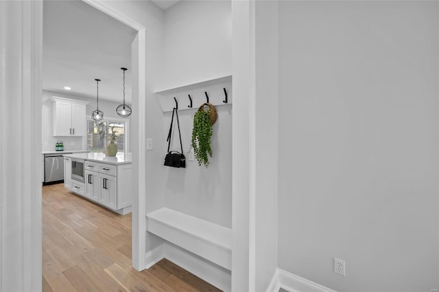 mudroom with light hardwood / wood-style flooring