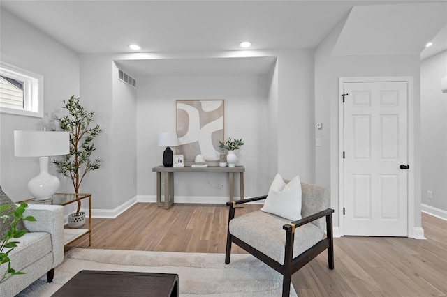 living area with light hardwood / wood-style floors