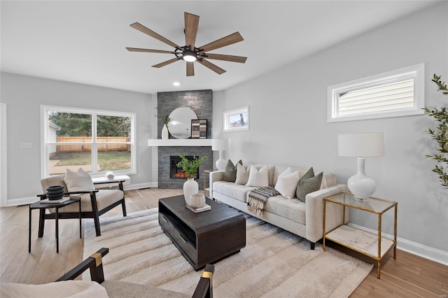 living room featuring plenty of natural light and light hardwood / wood-style floors