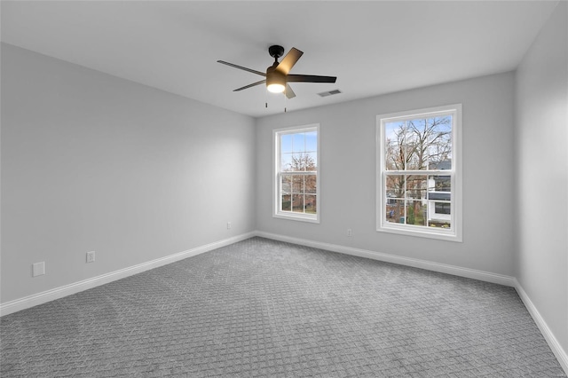 carpeted empty room with ceiling fan