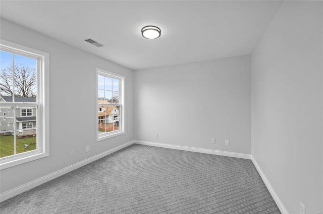 empty room featuring carpet flooring