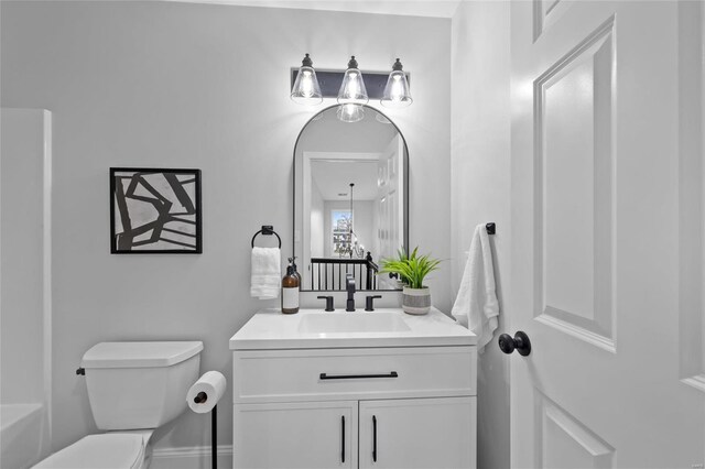 bathroom featuring vanity and toilet