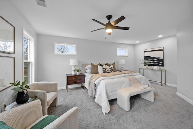 bedroom featuring ceiling fan and light carpet