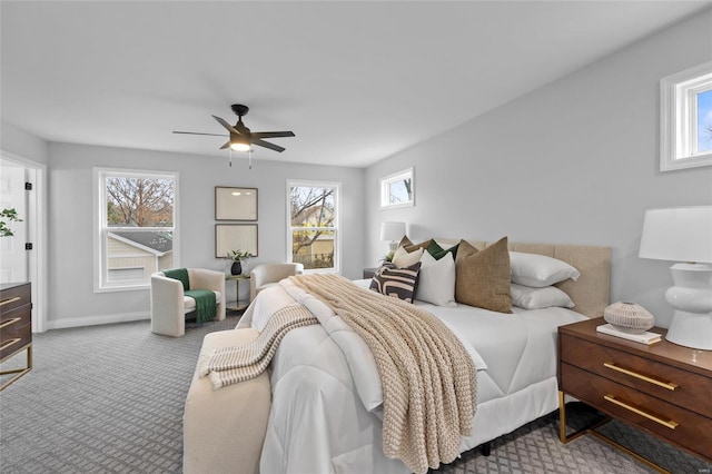 bedroom featuring ceiling fan and light colored carpet