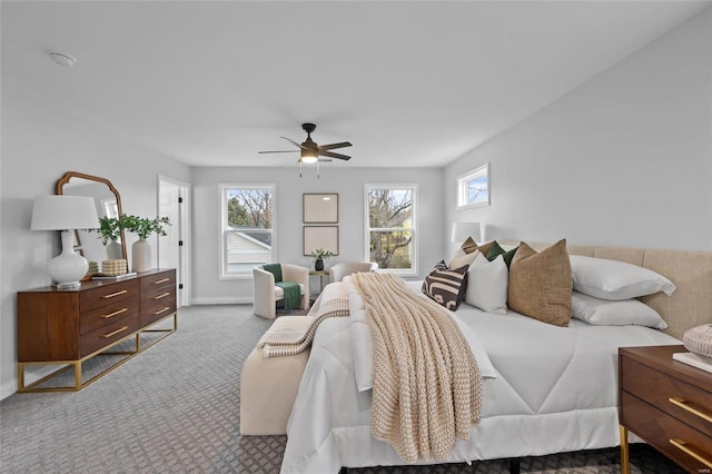 bedroom with ceiling fan and light carpet