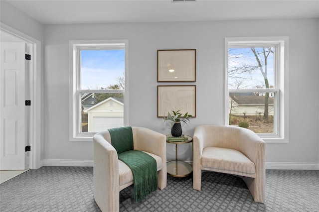 sitting room featuring carpet and a healthy amount of sunlight