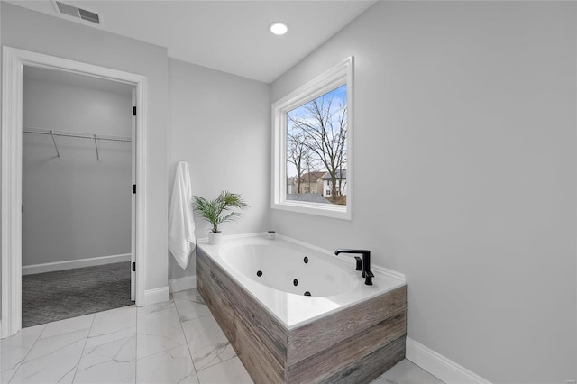 bathroom with tiled bath