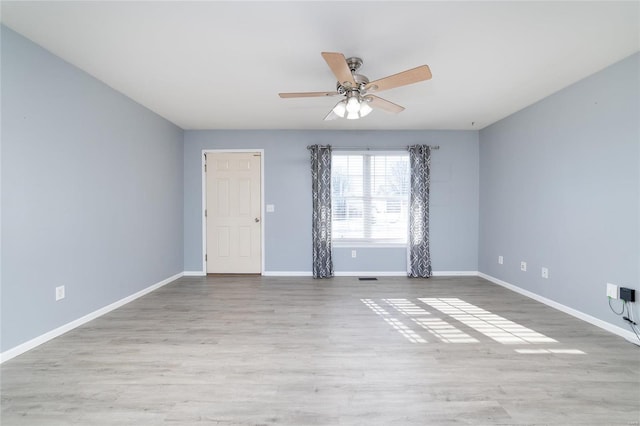 spare room with light hardwood / wood-style floors and ceiling fan