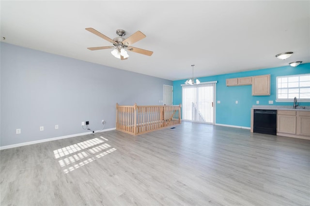 unfurnished living room with ceiling fan, light hardwood / wood-style floors, and a wealth of natural light