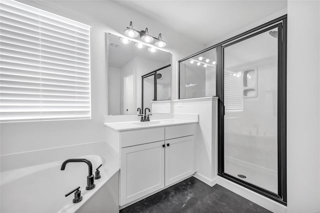 bathroom with vanity and separate shower and tub