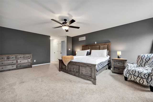 bedroom with ceiling fan and light carpet