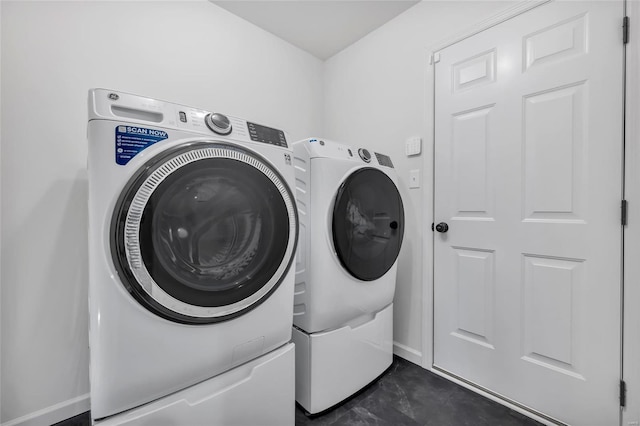 washroom with independent washer and dryer