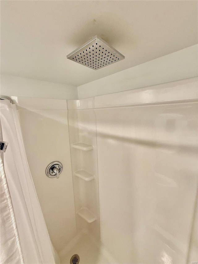 bathroom with a shower with shower curtain