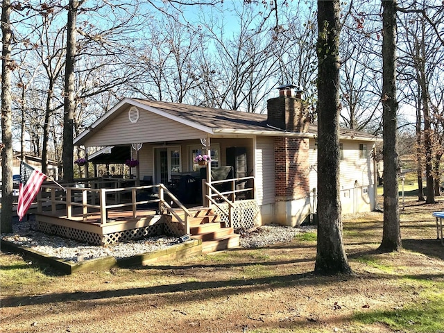 view of front of house featuring a porch and a wooden deck