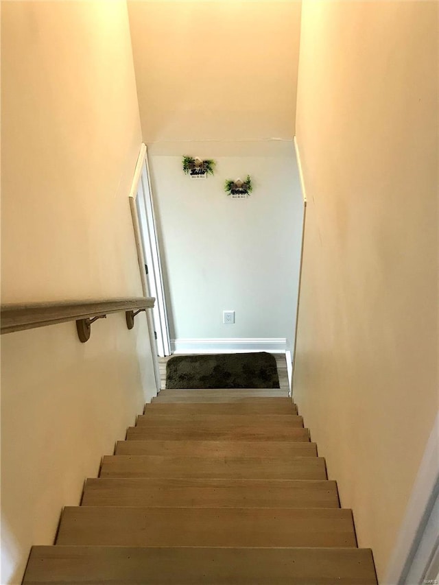 stairs with wood-type flooring