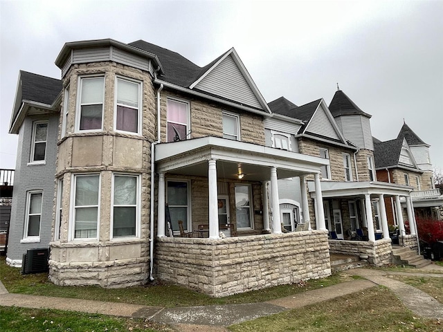 view of front of property featuring central AC unit and a porch