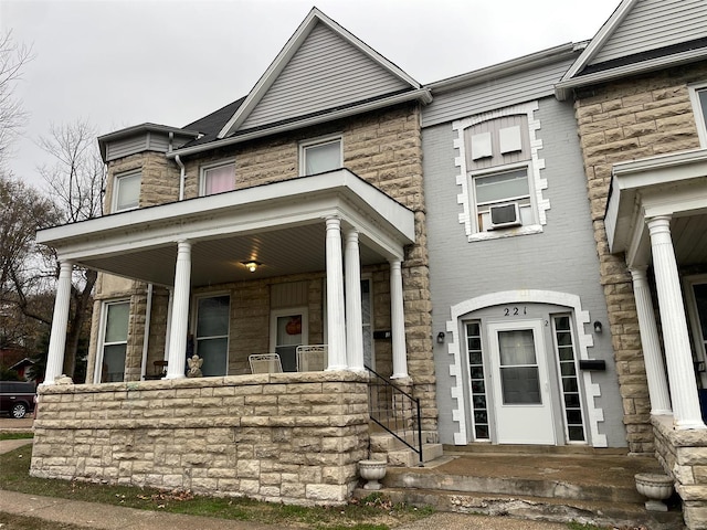 view of front of home with cooling unit and covered porch