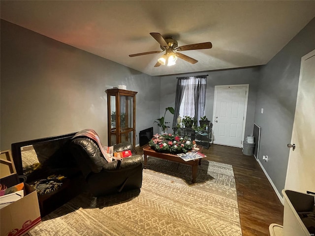 living room featuring ceiling fan and wood-type flooring