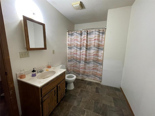 full bathroom with shower / bath combination with curtain, vanity, a textured ceiling, and toilet