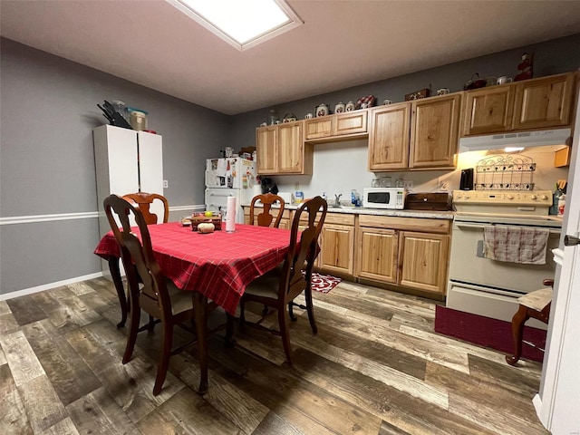 dining room with dark wood-type flooring