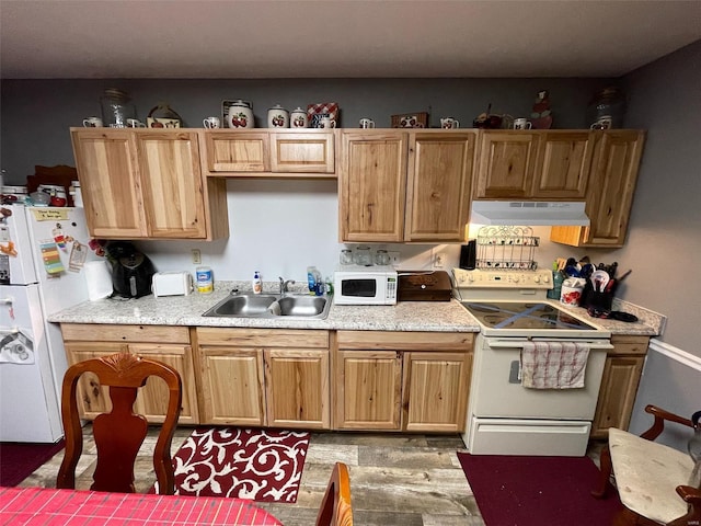 kitchen featuring white appliances and sink