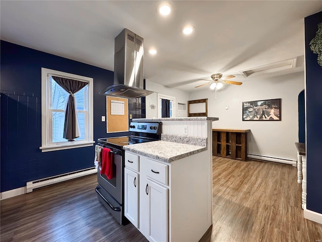 kitchen featuring island exhaust hood, dark hardwood / wood-style flooring, a baseboard radiator, white cabinetry, and black / electric stove