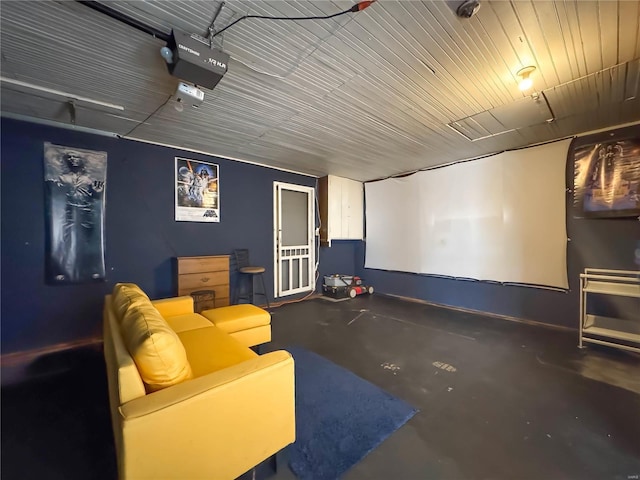 cinema room featuring concrete flooring