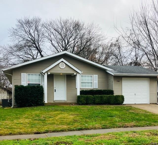 ranch-style house with central AC unit, a garage, and a front yard