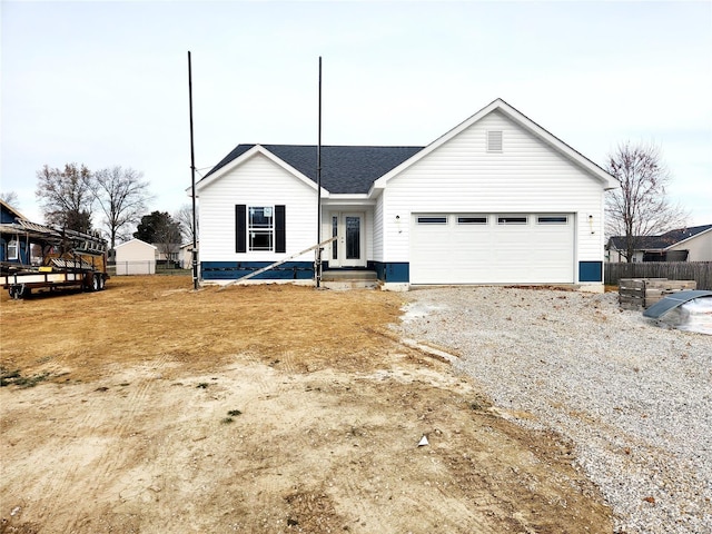 ranch-style house featuring a garage