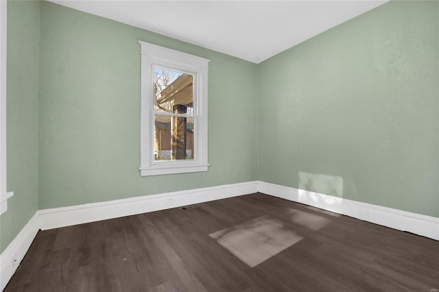 unfurnished room with hardwood / wood-style floors