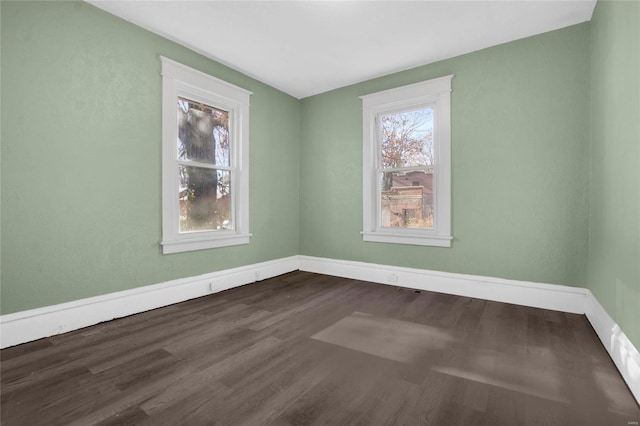 unfurnished room featuring wood-type flooring