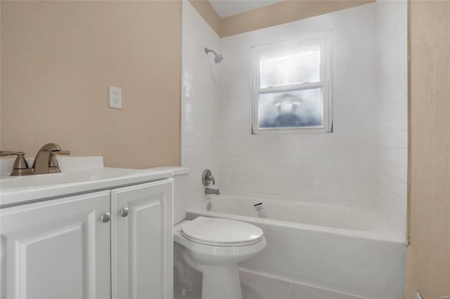 full bathroom with tile patterned floors, toilet, vanity, and tiled shower / bath