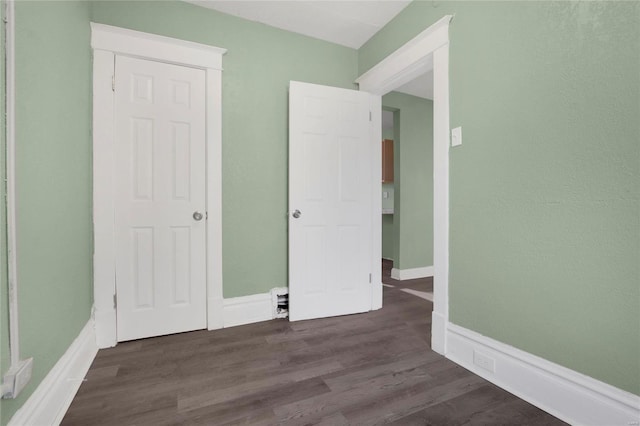 interior space with dark hardwood / wood-style flooring