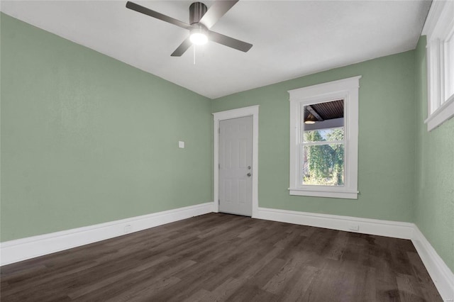 unfurnished room featuring dark hardwood / wood-style flooring, ceiling fan, and plenty of natural light