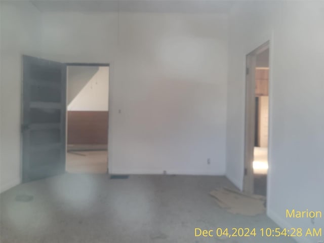 unfurnished room featuring concrete flooring