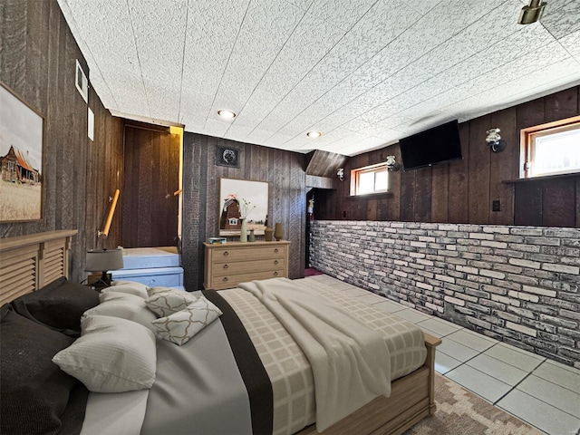 tiled bedroom with brick wall and wooden walls