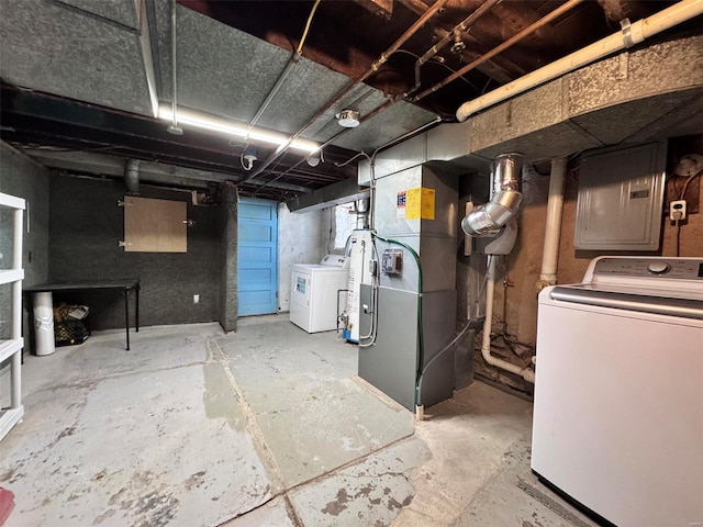 basement with separate washer and dryer, heating unit, and electric panel