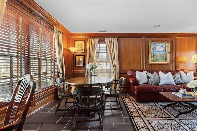 dining area with wooden walls