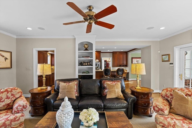 living room with crown molding and ceiling fan