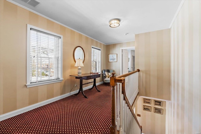 hall featuring crown molding and carpet