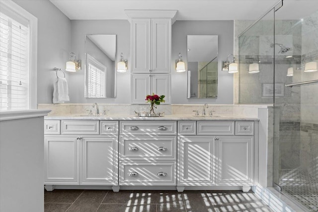 bathroom featuring vanity, tile patterned flooring, and walk in shower