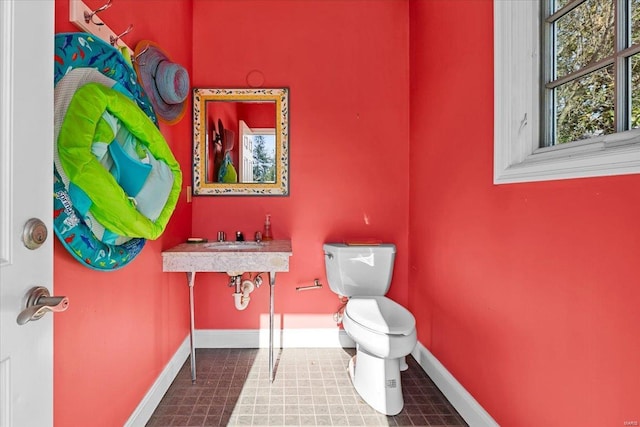 bathroom featuring tile patterned flooring and toilet