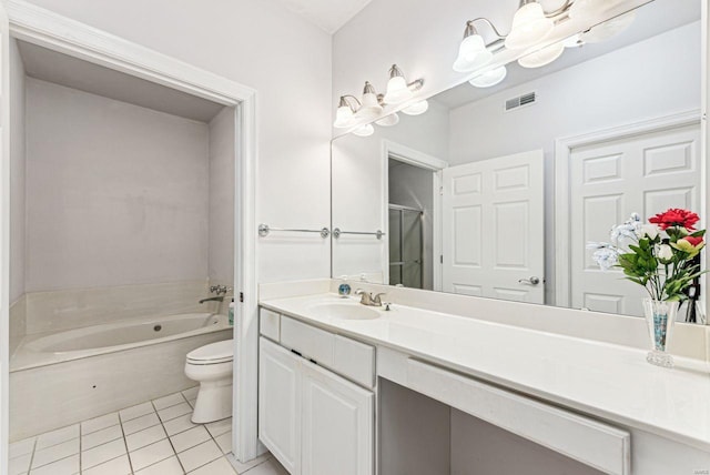 bathroom featuring toilet, a bathing tub, tile patterned floors, and vanity