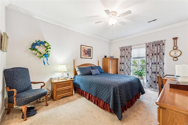 carpeted bedroom featuring ceiling fan and ornamental molding