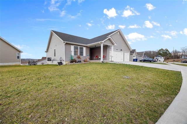 view of front of property featuring a garage and a front yard