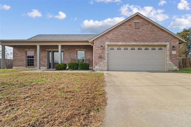 view of front of home with a front lawn and a garage