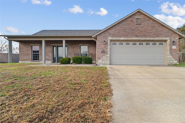 single story home with a front yard and a garage